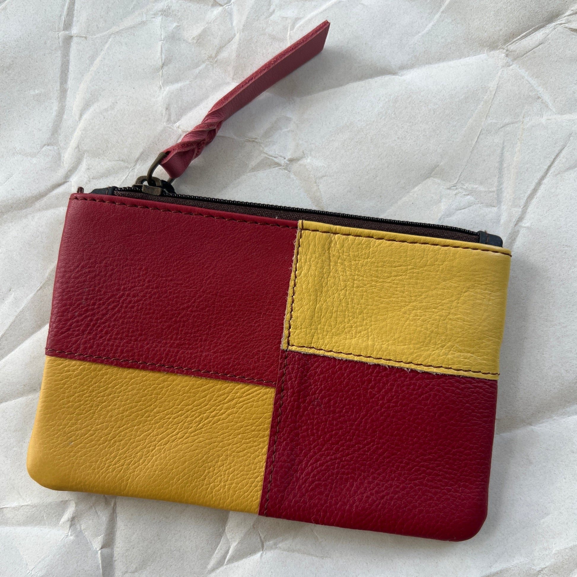 zahra pouch with yellow and red patchwork.