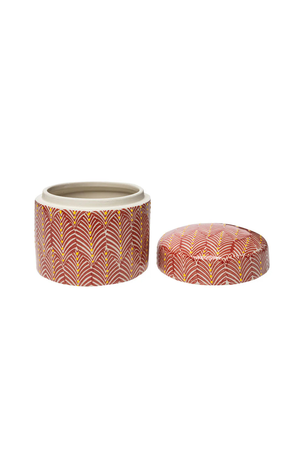 Decorative container with its lid set next to it on a white background