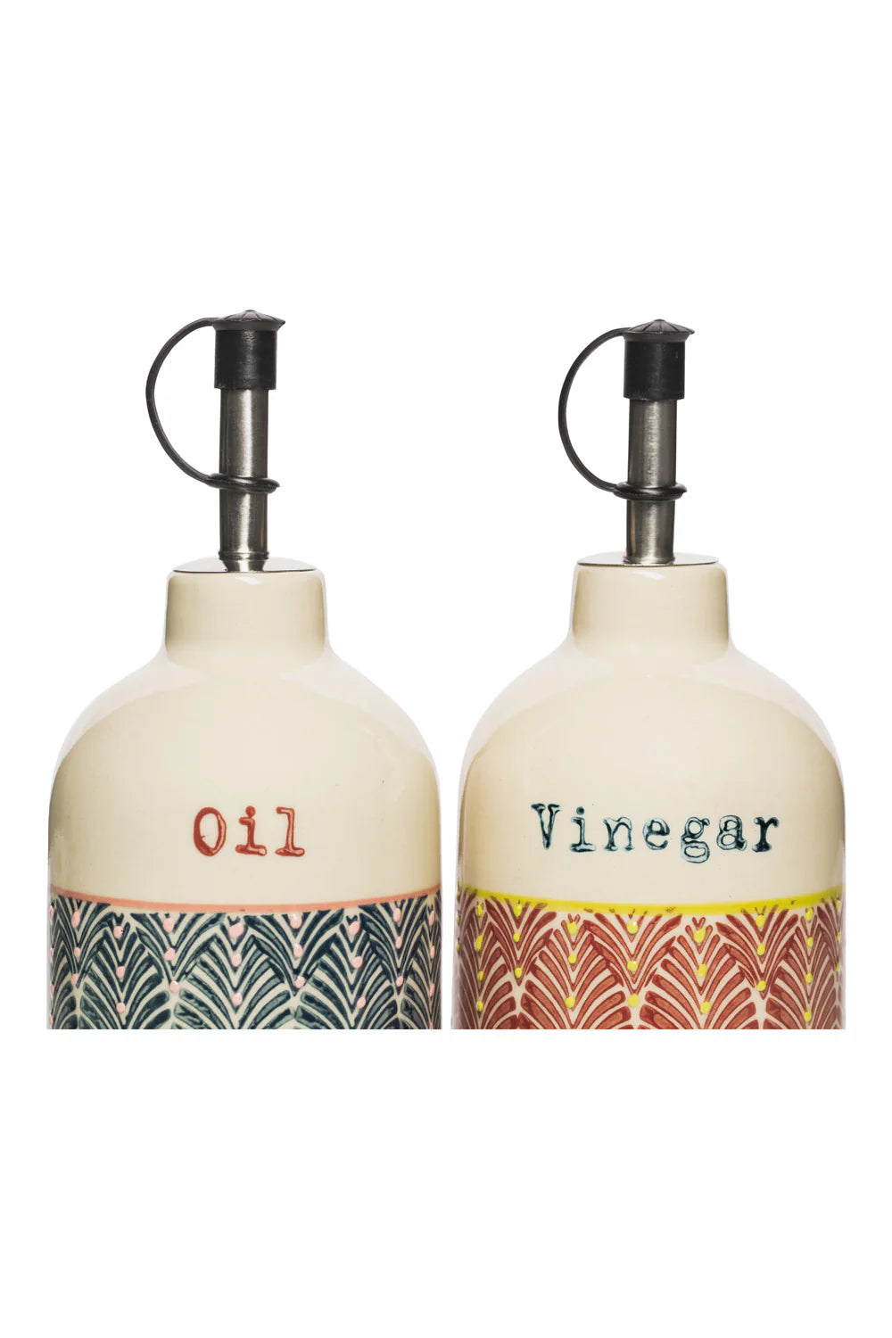 close-up of Two ceramic oil and vinegar bottles with decorative patterns