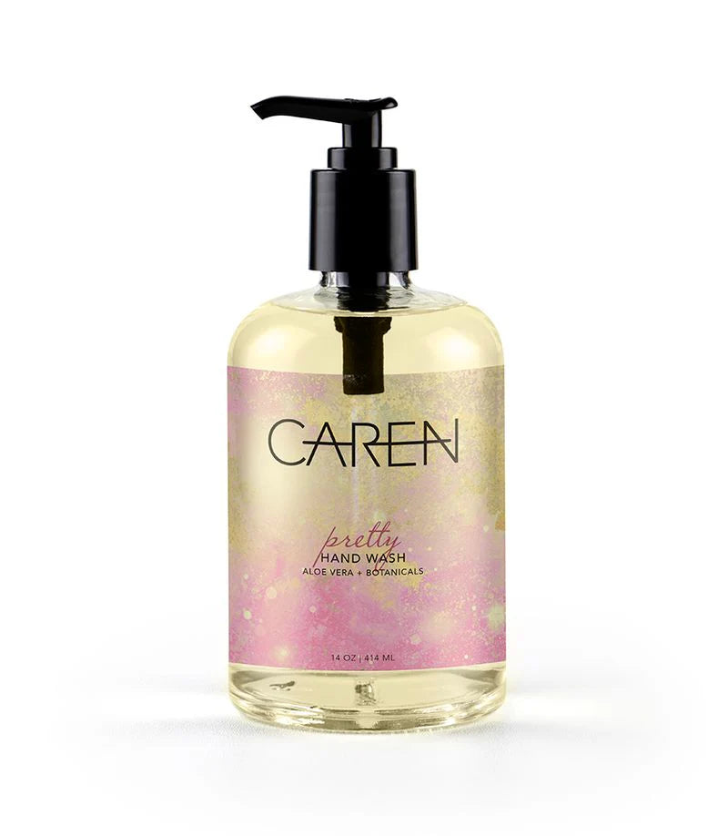 glass bottle with pink and gold label filled with pretty hand wash.