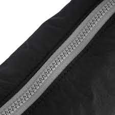 view of black farringdon sling bag zipper
