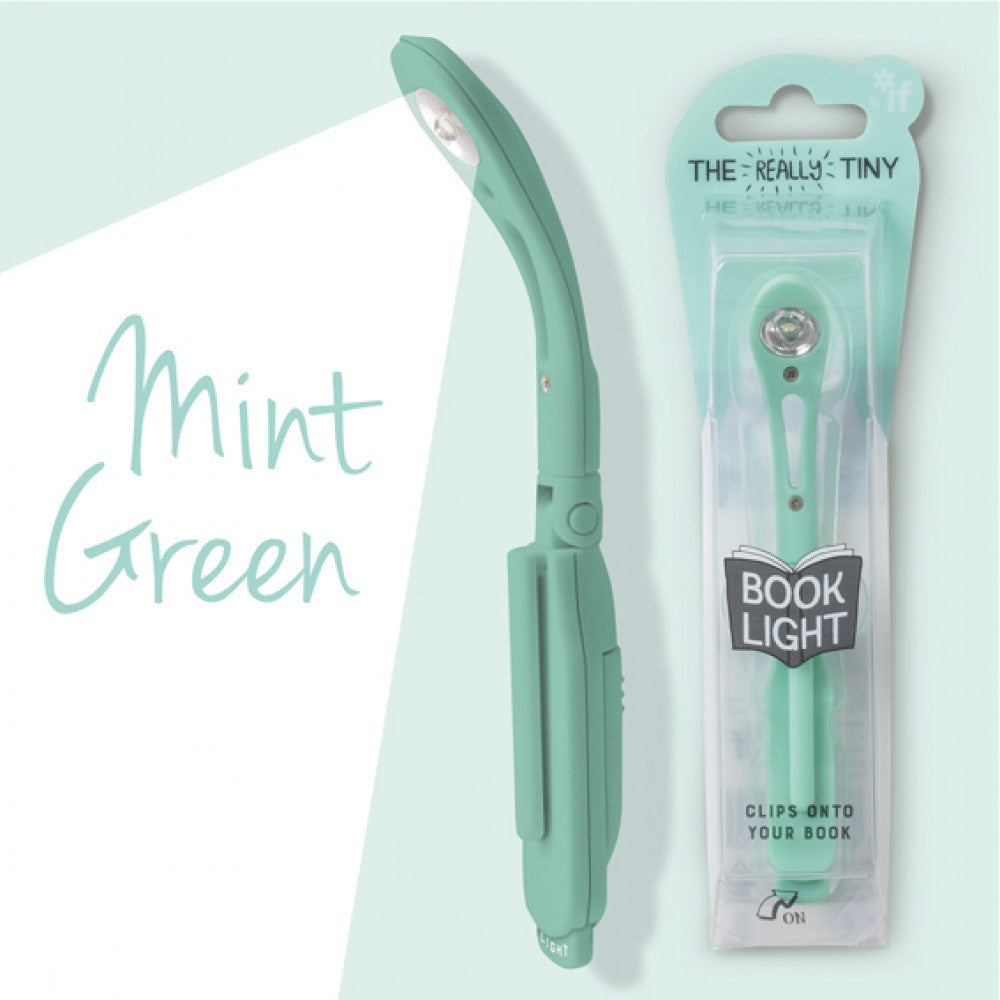 Mint green book light with packaging on a light blue background