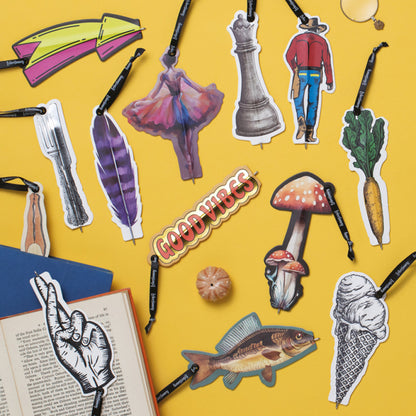 Collection of various illustrated flat pens on a yellow background