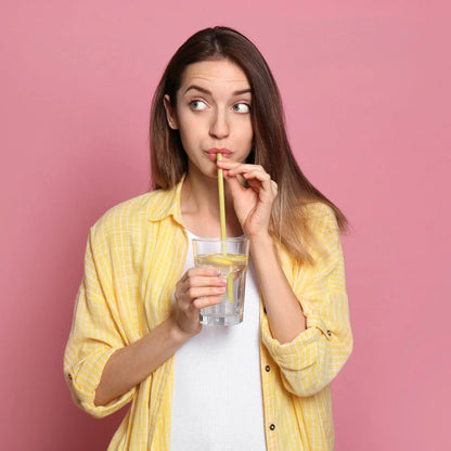 person sipping a beverage through a Pasta Straw