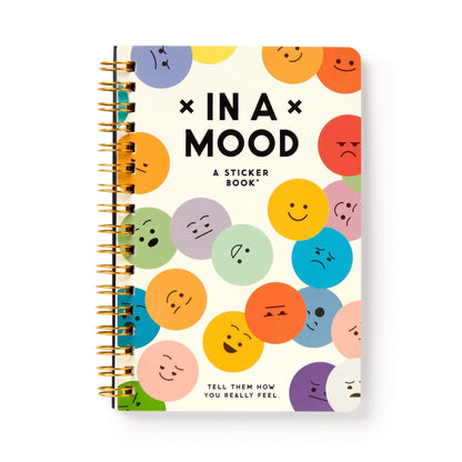 spiral book with multicolored mood faces and black title text on the cover