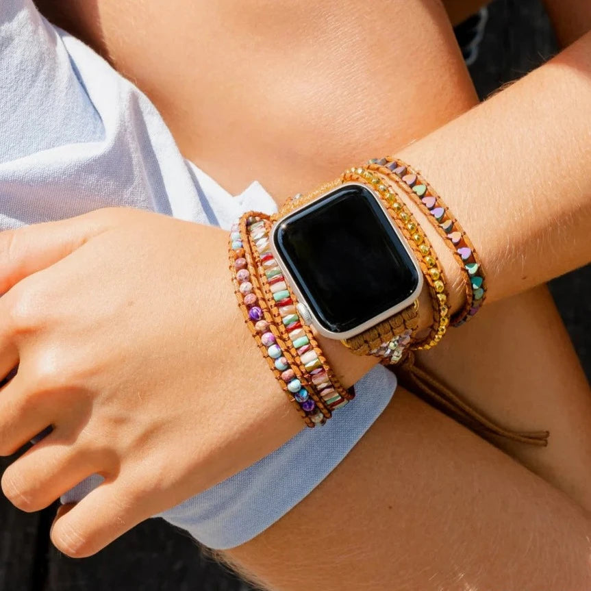 close-up of person's wrist wearing intense love watch strap on an apple watch.