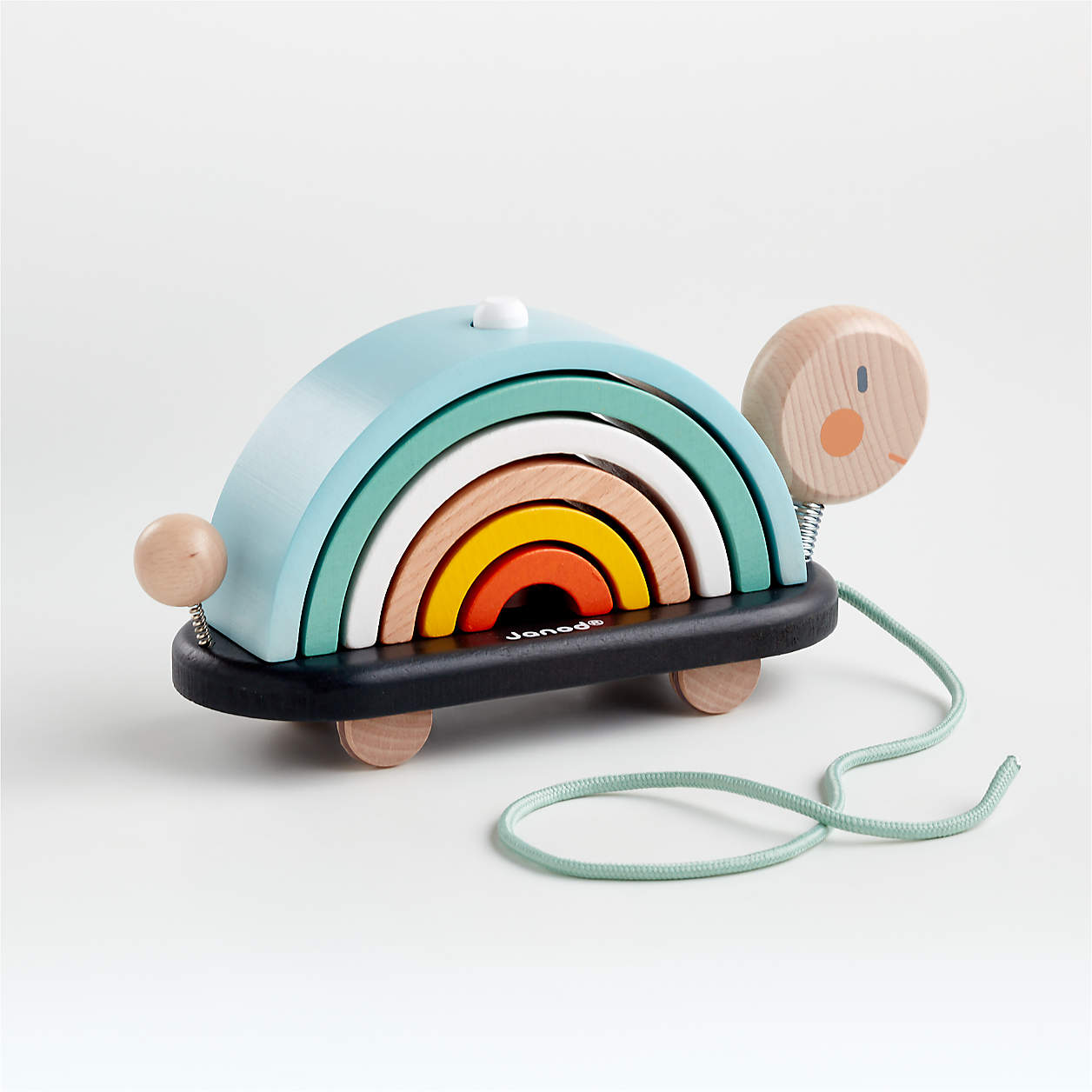 wooden turtle with rainbow shaped wooden pieces cocooned together to form the back of the turtle on a pully string
