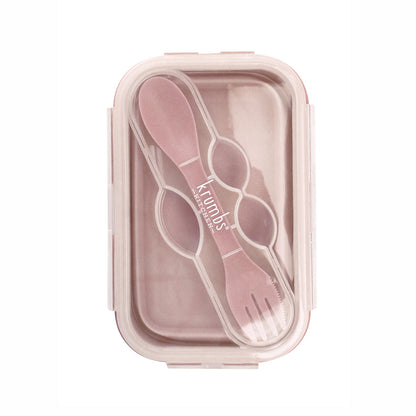 pink silicone container with utensil in the lid.
