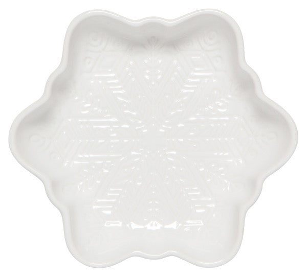 white ceramic dish shaped like a snowflake with a snowflake design on the interior.