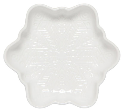 white ceramic dish shaped like a snowflake with a snowflake design on the interior.