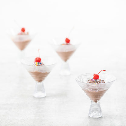 4 clear jupiter martini glasses filled with chicilate ice cream and garnished with a cherry.