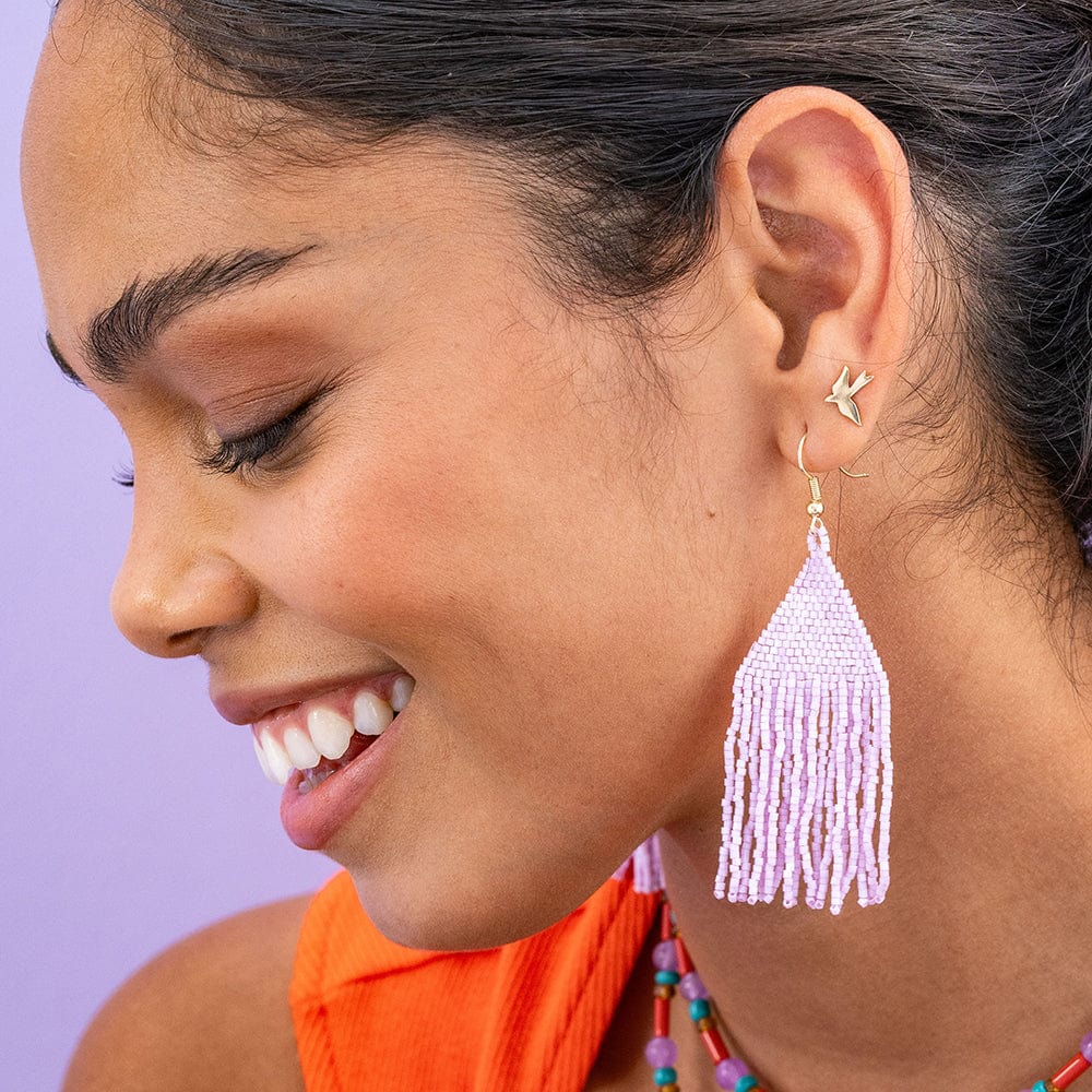 smiling person wearing lavender  Beaded Fringe Earrings