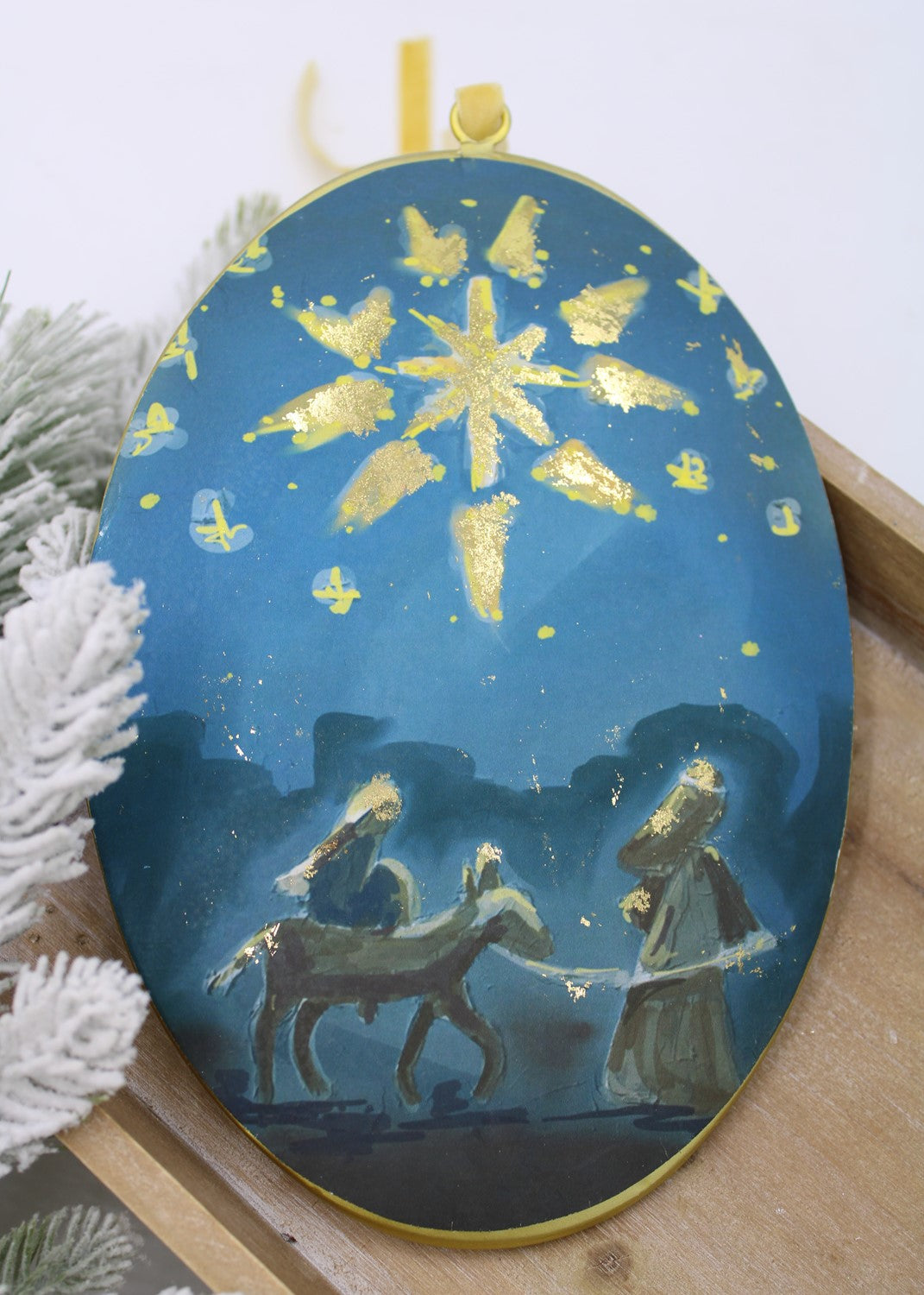 Mary and joseph disc ornament.