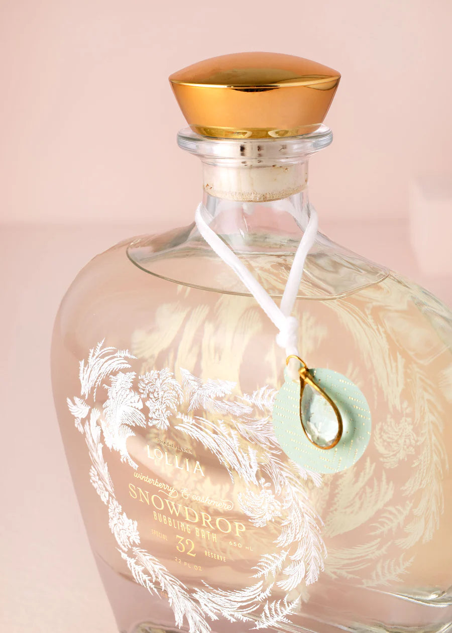 close-up side view of Glass bottle of snowdrop bubble bath