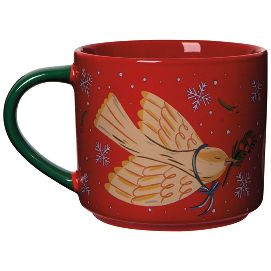 Red mug with dove design and snowflakes on a white background