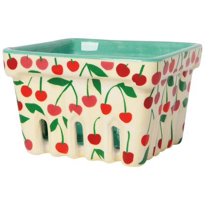 cream berry basket with red cherries images on the outside of the basket inside of the basket is seafoam green