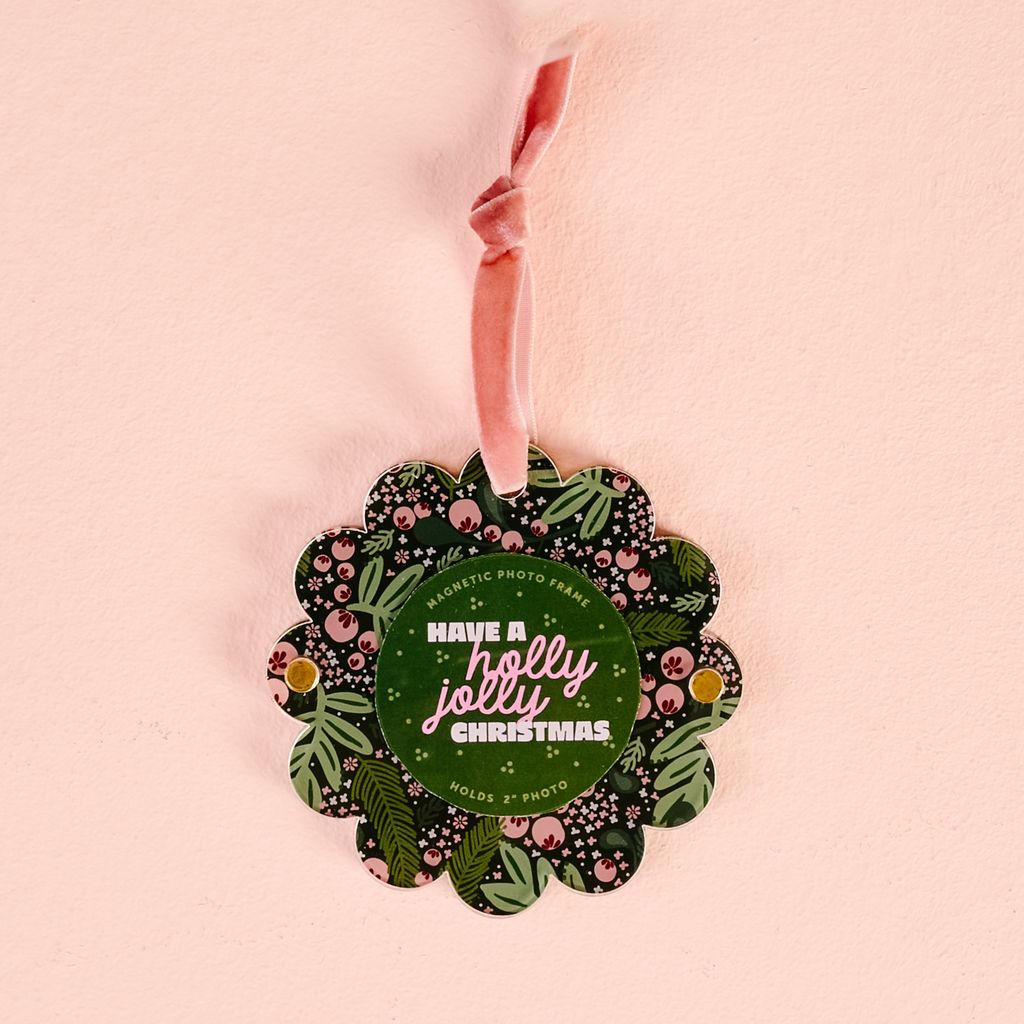 flat scallop edge ornament with pink and green holly imagery