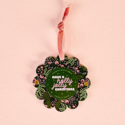 flat scallop edge ornament with pink and green holly imagery