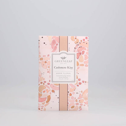 Cashmere Kiss Large Sachet printed with hues of orange and pink swirls displayed against a grey background.
