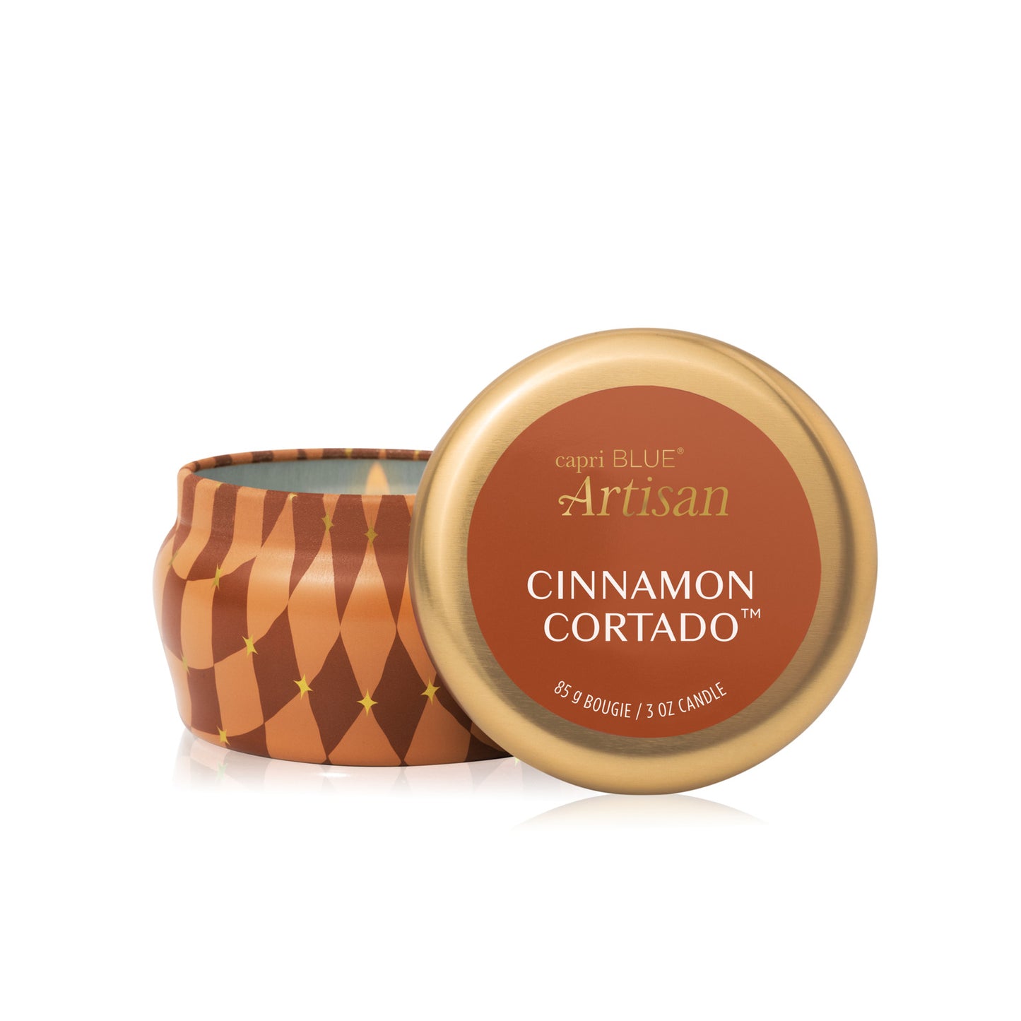 Cinnamon Cortado Artisan Winter Bazaar Mini Tin Candle with its lid propped in front of it shown on a white background
