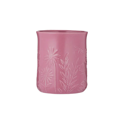 Pink textured utensil crock on a white background