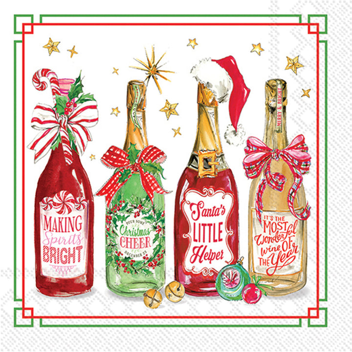 Decorative paper napkin with Christmas-themed wine bottles and festive text on a white background.