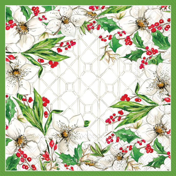 Decorative paper napkin with floral design featuring white flowers, green leaves, and red berries on a geometric patterned background.
