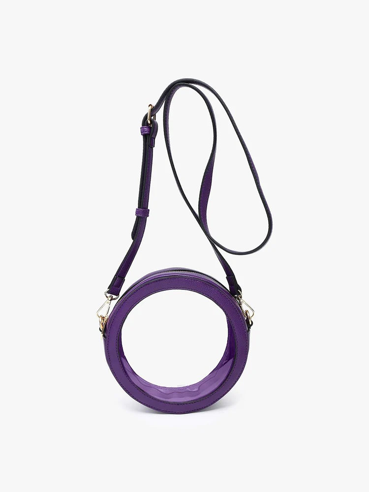 round clear bag with purple strap and handle.