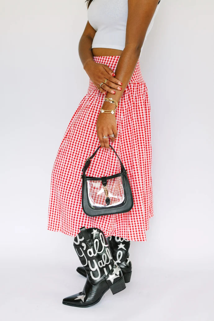 a person holding the Paige Clear Stadium Bag in Black