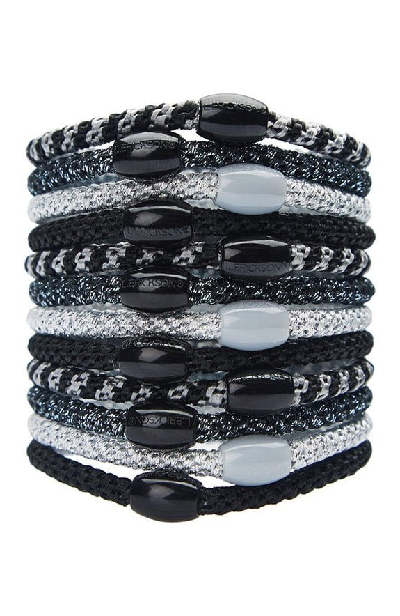 stack of midnight ponytail holders each with coordinating oval bead on a white background.