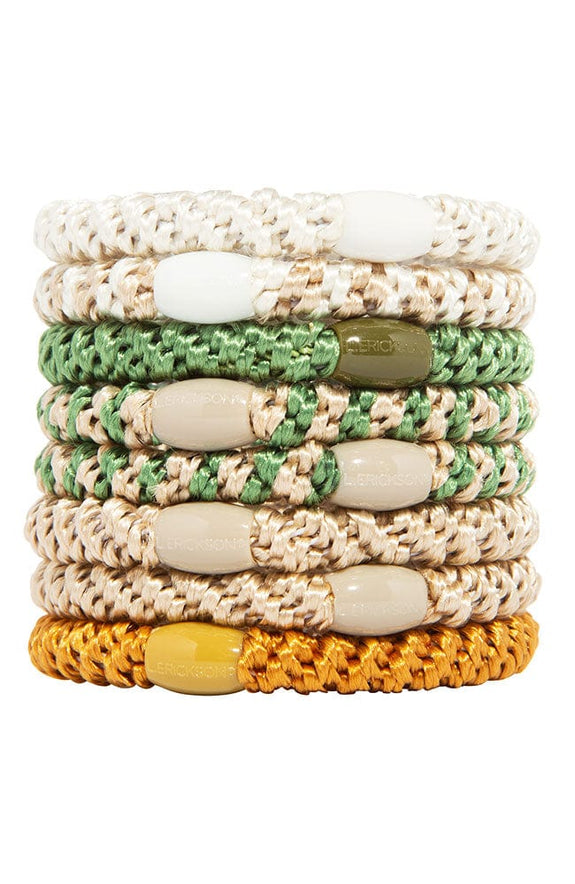 stack of 8 ponytail holders each with coordinating oval bead on a white background.