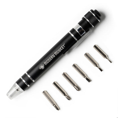 black Screwd Up 6-In-1 Screwdriver arranged with assorted bits