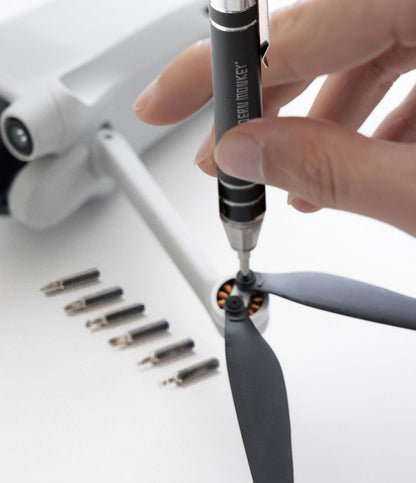 hand using  to tighten small screws