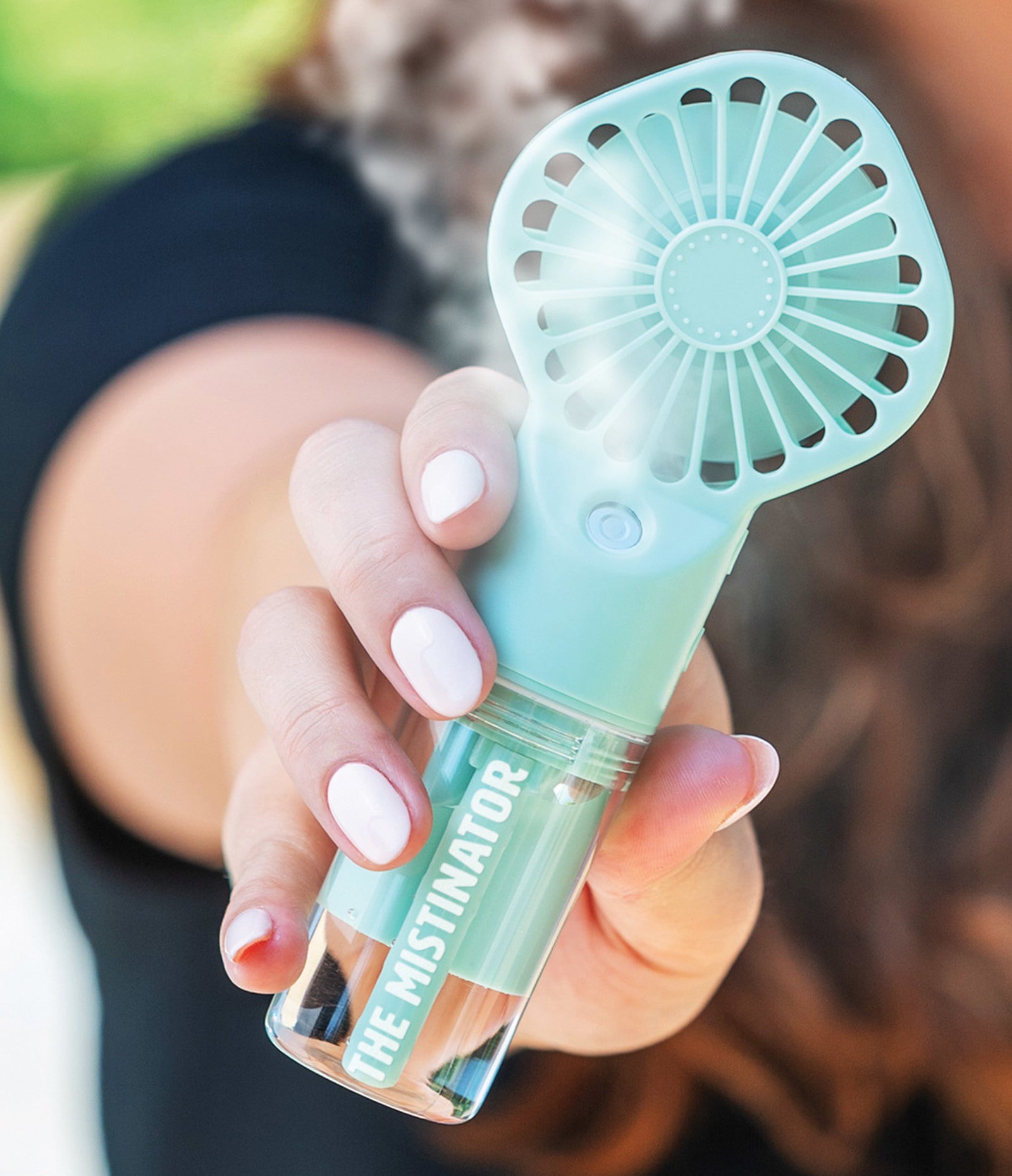 hand holding green Mistinator 2-in-1 Rechargeable Water Fan