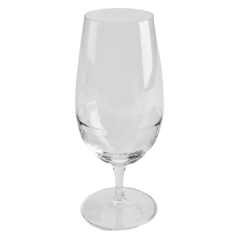stemmed glass with dimpled pattern around the base on a white background.
