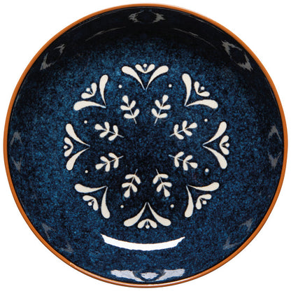 top view of nightbloom pasta bowl with white floral patterns on a white background