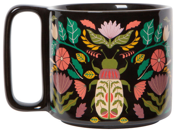 other side of mug with scarabs and beetles in hues of pinks and greens