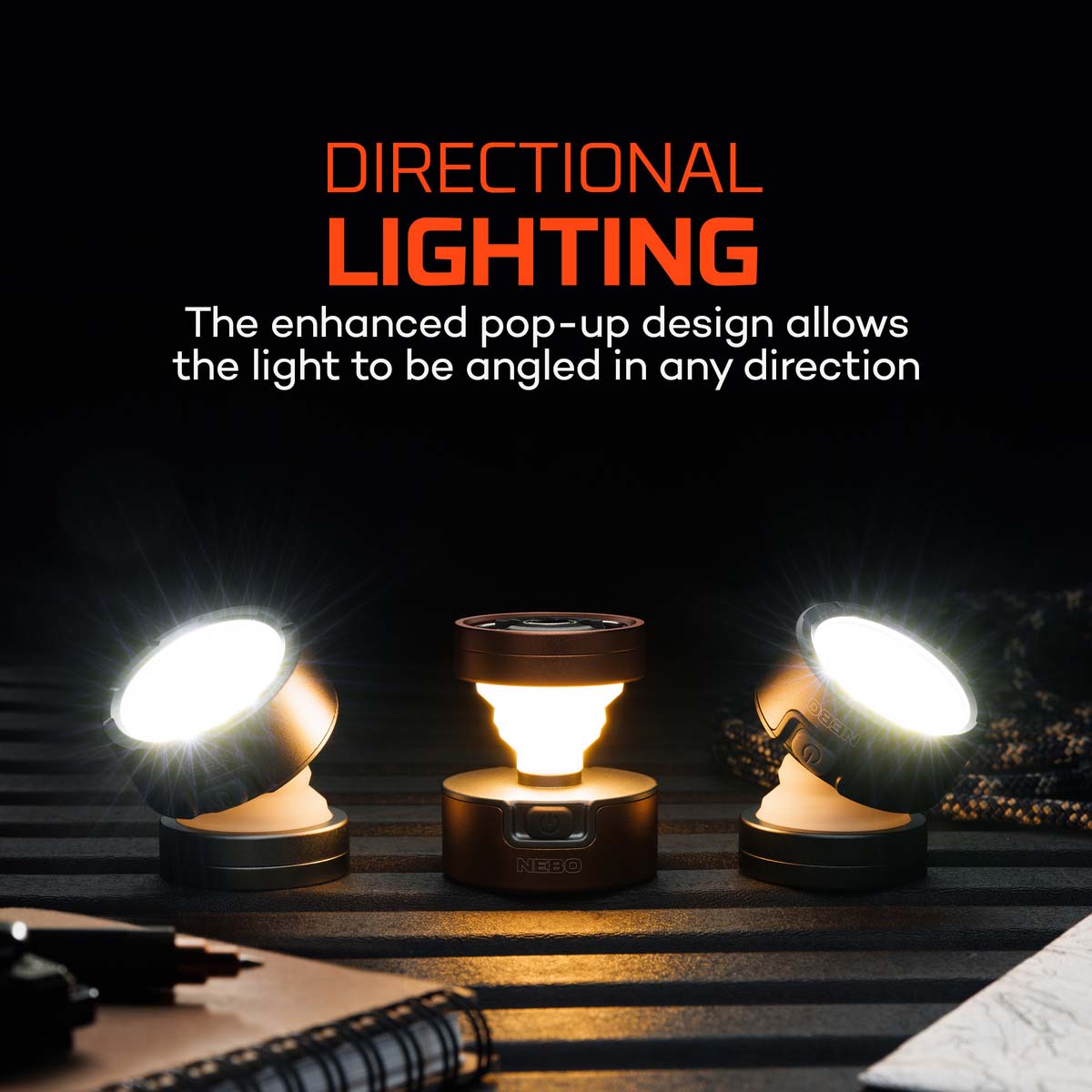 Three portable lights with directional lighting feature on a dark background