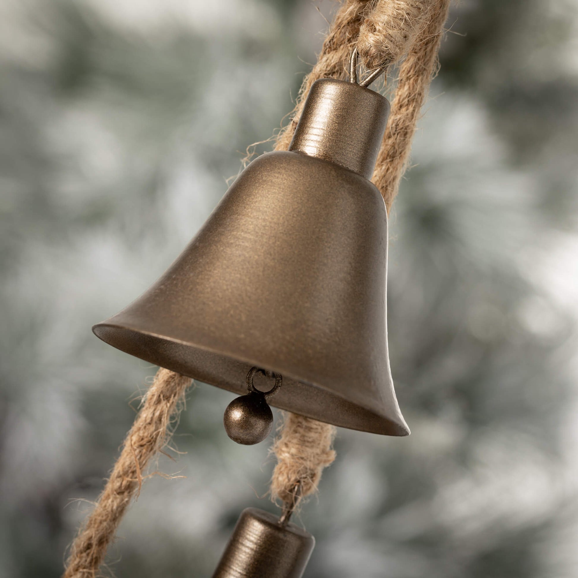 close up view of the bronze christmas bell swag