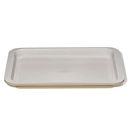 OXO metal and ceramic jellyroll pan That is beige on the outside and lighter beige on the inside