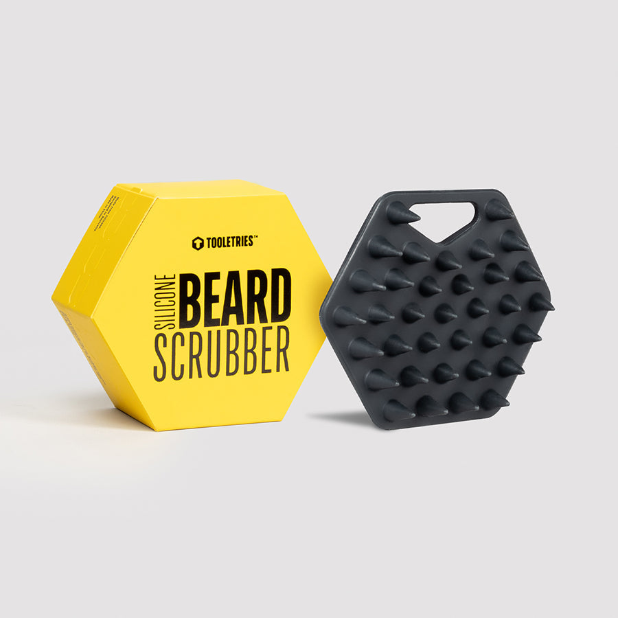 black beard scrubber set next to its yellow box packaging.