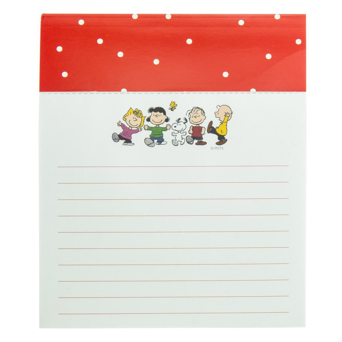 lined notepad with peanuts characters at the top