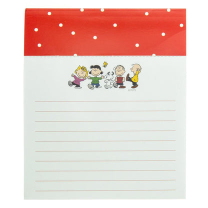 lined notepad with peanuts characters at the top