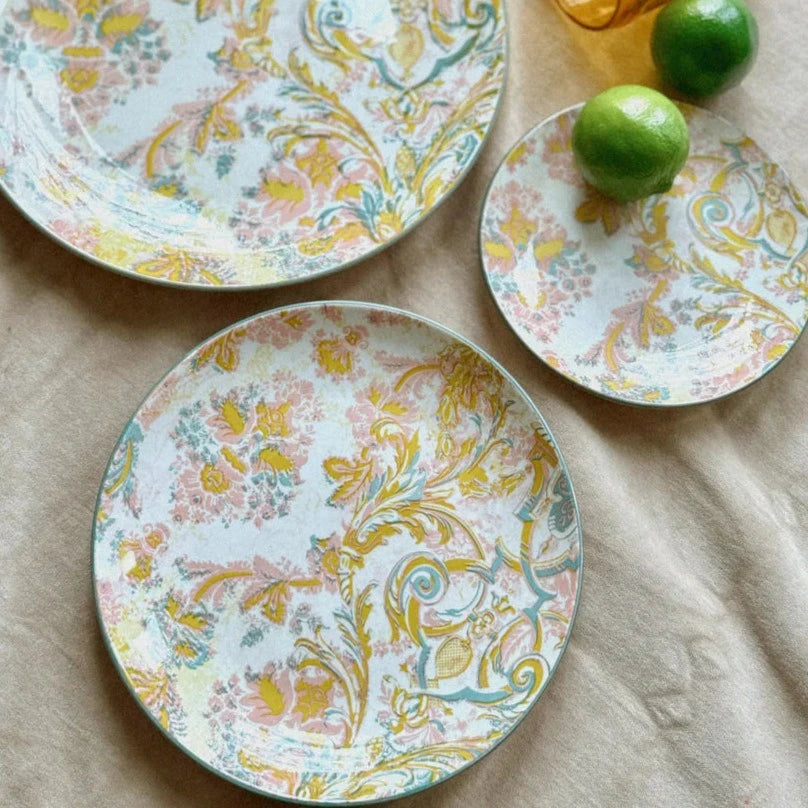 elisa plates arranged on a table with a taupe linen table cloth.