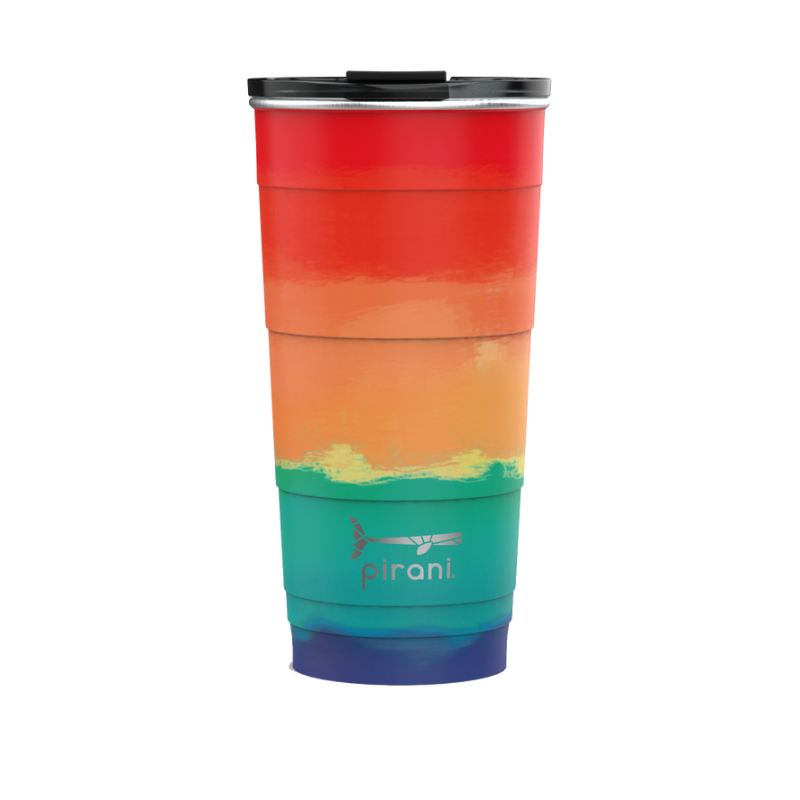 sunset tumbler with silver pirani logo near the bottom of cup and a lid on it, ombre color pallet from bottom to top is blues, greens, oranges, and red.