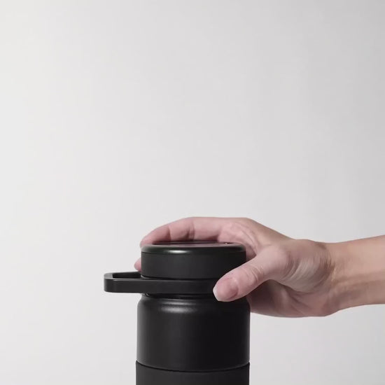 video without sound of a hand lifting the lid with the straw off the rotera water bottle