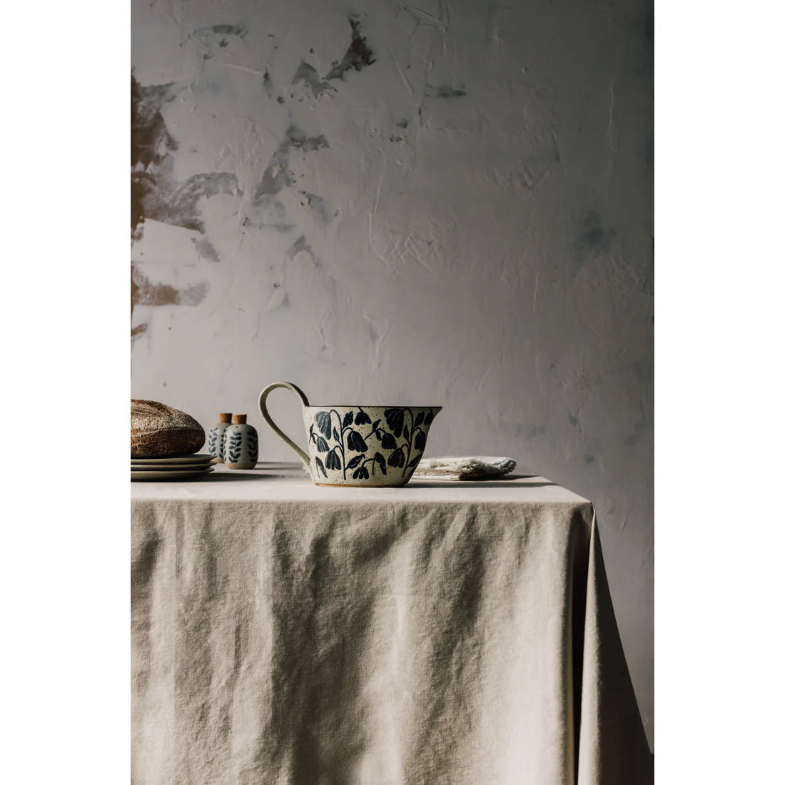 elements gravy boat set on a table with other dishes