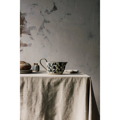 elements gravy boat set on a table with other dishes
