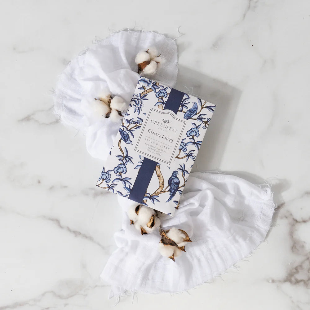 Classic Linen Large Sachet arranged with white linen cloth and cotton stems