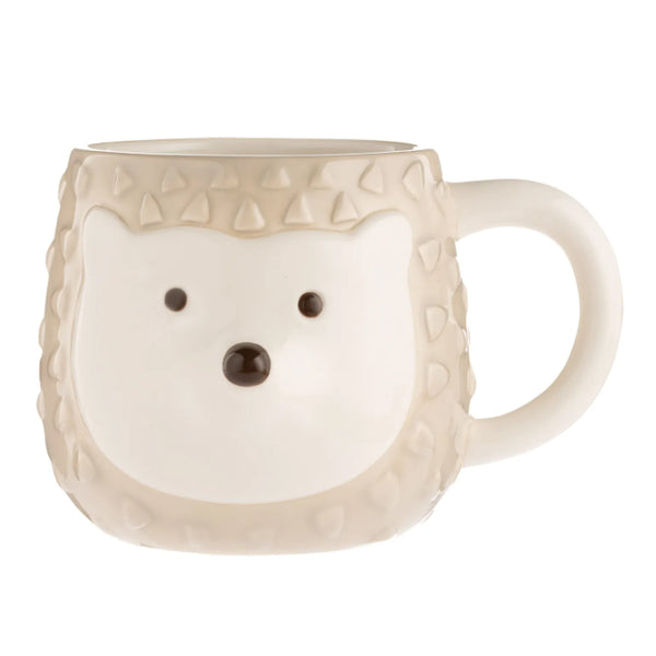 off-white and tan ceramic mug with hedgehog design.